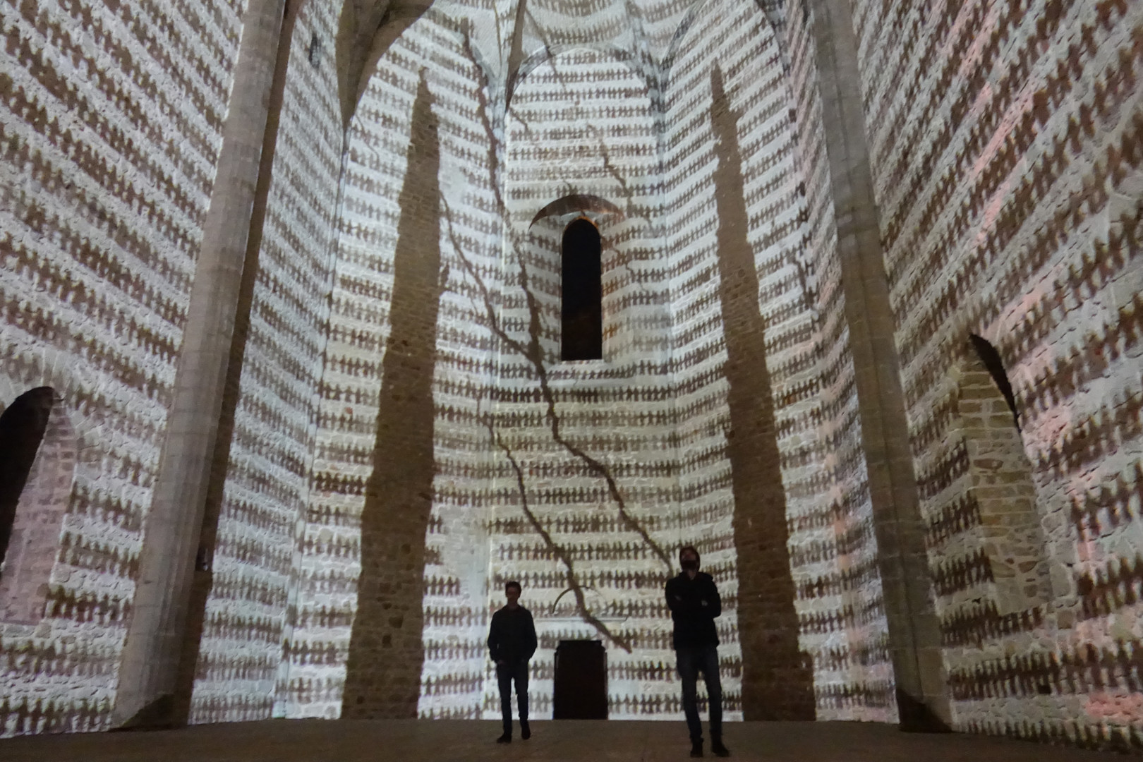 Michal Rovner, Crepe nel Muro, Palermo, 2019. Installation view, UBERMAUER BAM-Biennale Arcipelago Mediterraneo, Palermo, Italy, 2019. Site-specific video projection with audio.