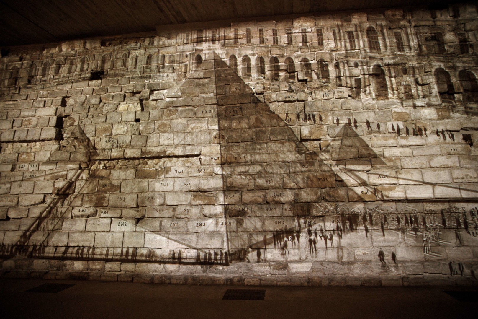 Michal Rovner, La Restauration du Louvre, 2011 (detail). Installation view, Louvre, Paris, France, 2011. Video installation.